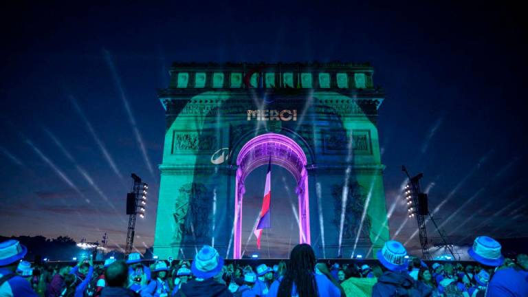 (FILES) The word “Merci” (Thank you) is displayed on the Arc de Triomph at the end of the parade of French athletes who competed in the Paris 2024 Olympic and Paralympic Games in Paris on Sept 14, 2024-AFP