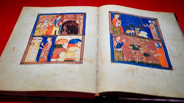 This photograph taken on August 19, 2025 shows the Sarajevo Haggadah manuscript preserved in a display case at Bosnia’s National Museum, in Sarajevo. - Elvis BARUKCIC / AFP