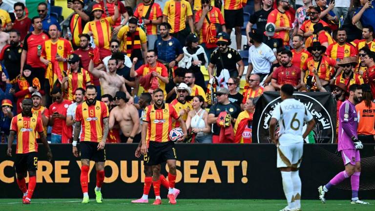 Esperance’s Algerian midfielder Youcef Belaili (3rd-L) reacts next to teammates as they wait for a penalty kick resolution by the Norwegian referee Espen Eskas during the FIFA Club World Cup 2025 Group D football match between US Los Angeles FC and Tunis’ Esperance Sportive de Tunis at the Geodis Park stadium in Nashville on June 20, 2025 - AFPpix