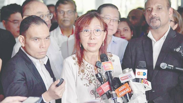 Kok speaking to media representatives after having her statement recorded at Bukit Aman yesterday. – BERNAMAPIC