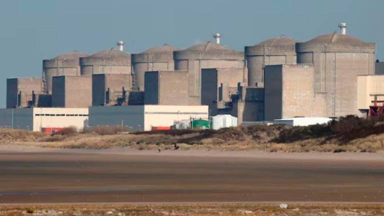 The Gravelines nuclear power plant is seen across the beach in Petit Fort Philippe, northern France, March 10, 2017. - REUTERS