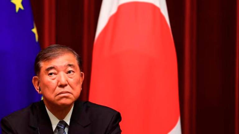 Japanese Prime Minister Ishiba Shigeru attends a joint press briefing with European Commission President Ursula von der Leyen (not pictured) and European Council President Antonio Costa (not pictured), after their meeting at Prime Minister Office on July 23, 2025, in Tokyo, Japan. - Pool via REUTERS