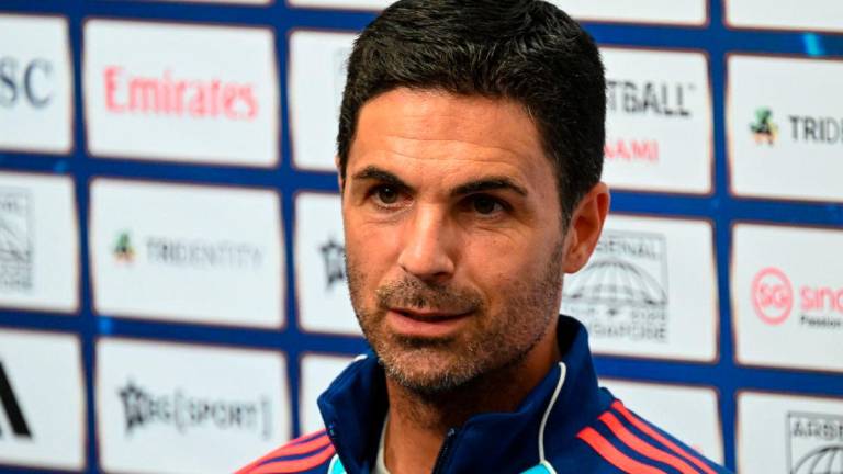 Arsenal’s Spanish manager Mikel Arteta attends a press conference ahead of their football match against AC Milan at the National Stadium in Singapore on July 21, 2025. (Photo by Roslan RAHMAN / AFP)