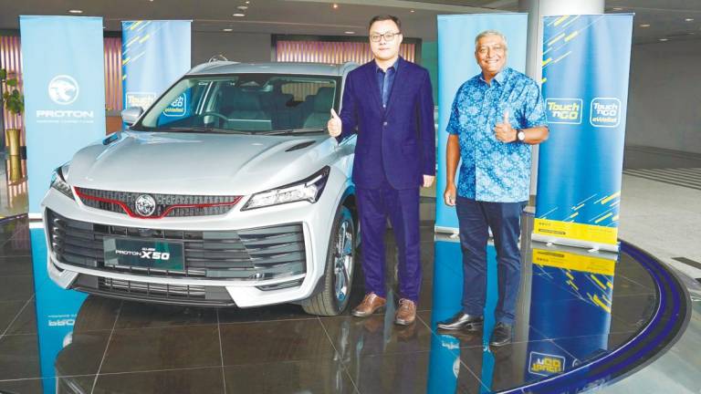 Praba and Zhang posing with the X50.