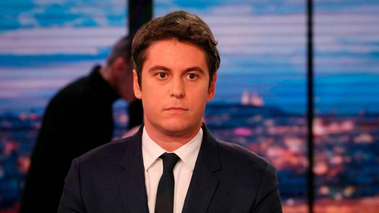French Prime Minister Gabriel Attal poses prior to an interview in the evening news broadcast of French TV channel TF1, in the TF1 studios in Boulogne-Billancourt, outside Paris, on March 27, 2024/AFPPix
