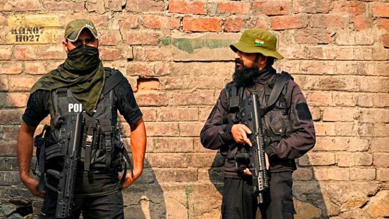 Indian security personnel stand guard near the site of a gunbattle between suspected militants and Indian forces in Srinagar - AFPpix