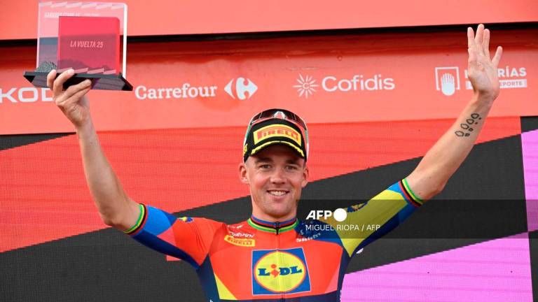 Stage winner Team Lidl-Trek's Danish rider Mads Pedersen celebrates on the podium after the 15th stage of the Vuelta a Espana cycling tour, a 167 km race between A Veiga/Vegaredo and Monforte de Lemos, on September 7, 2025. - AFP
