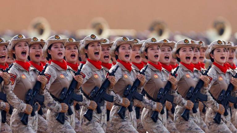 Chinese militia members march during a military parade to mark the 80th anniversary of the end of World War Two, in Beijing, China yesterday. – Reuterspic