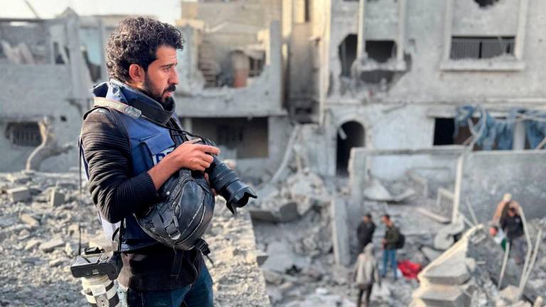 AFP journalist Omar Al-Qattaa poses for a picture in the Gaza Strip on December 26, 2024. - AFPPIX