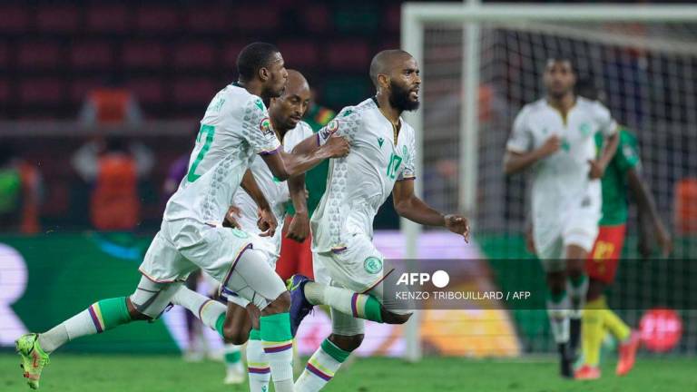 Comoros' midfielder Youssouf M'Changama (R) celebrates scoring his team's first goal during the Africa Cup of Nations (CAN) 2021 round of 16 football match between Cameroon and Comoros at Stade d'Olembe in Yaounde on January 24, 2022. - AFP