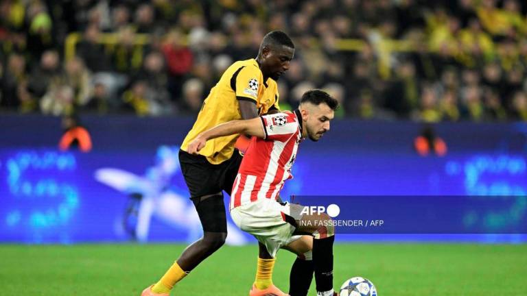 Dortmund's Guinean forward #09 Serhou Guirassy (L) and Athletic Bilbao's Spanish defender #04 Aitor Paredes vie for the ball during the UEFA Champions League - league phase day 2 football match of BVB Borussia Dortmund v Athletic Club Bilbao at the Signal Iduna stadium in Dortmund, western Germany on October 1, 2025. - AFP
