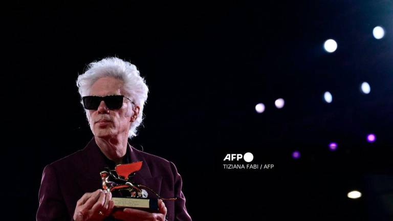 US director Jim Jarmusch poses with the Golden Lion for Best Film he reveived for 'Father Mother Sister Brother' after the award ceremony of the 82nd Venice Film Festival on September 6, 2025 at Venice Lido. (Photo by Tiziana FABI / AFP)
