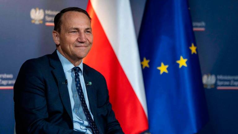 Poland’s Minister of Foreign Affairs Radoslaw Sikorski smiles during the interview for Agence France Presse, Polish Press Agency (PAP) and German Press Agency (DPA) at ministry building in Warsaw on June 26, 2025. (Photo by Wojtek RADWANSKI / AFP)