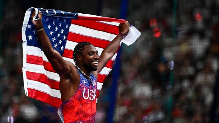 US’ Noah Lyles celebrates after winning the men’s 100m final of the athletics event at the Paris 2024 Olympic Games at Stade de France in Saint-Denis - AFPpix