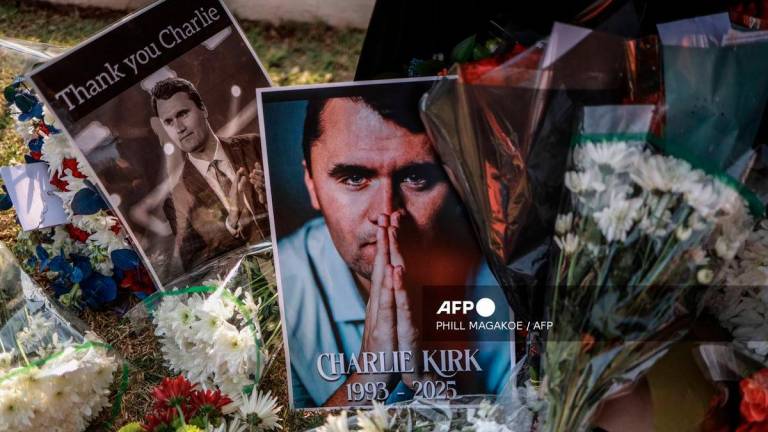 A general view of a wreath laid by mourners outside the US Embassy in Pretoria on September 11, 2025 following the fatal shooting of US youth activist and influencer Charlie Kirk while speaking during an event at Utah Valley University in Orem, Utah, United States. - AFP