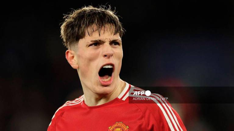 Manchester United's Argentinian midfielder #17 Alejandro Garnacho celebrates after scoring their second goal during the English Premier League football match between Leicester City and Manchester United at King Power Stadium in Leicester, central England on March 16, 2025. - AFP