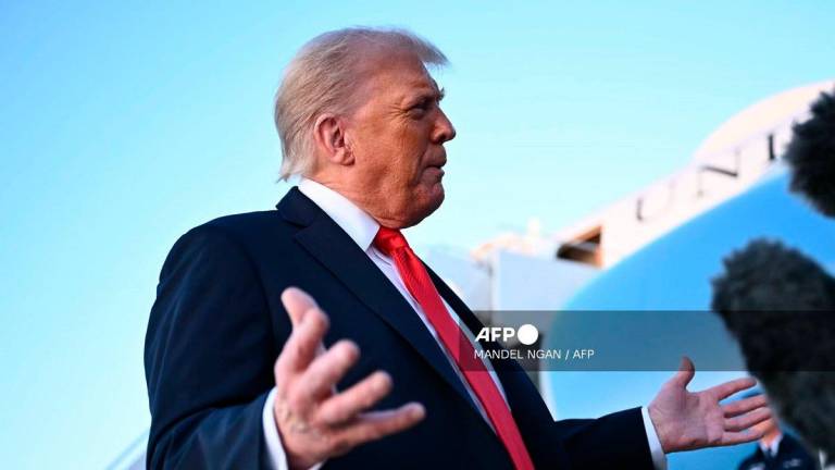 US President Donald Trump speaks to reporters after stepping off Air Force One upon returning to Joint Base Andrews in Maryland on September 7, 2025. - Mandel NGAN / AFP