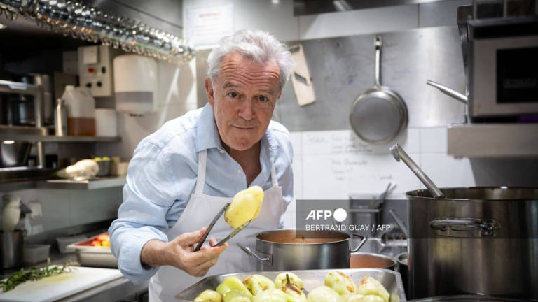 French chef Alain Passard poses in his restaurant 'L'Arpege' in Paris during a photo session on July 22, 2025. - AFP