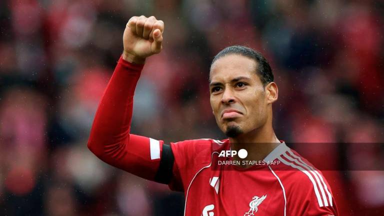 Liverpool's Dutch defender #04 Virgil van Dijk reacts following the English Premier League football match between Liverpool and Everton at Anfield in Liverpool, north west England on September 20, 2025. - AFP