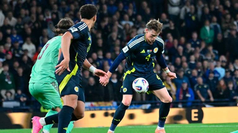 Scotland’s midfielder #04 Scott McTominay (C) controls the ball before scoring their second goal during the 2026 World Cup Group C qualifier football match between Scotland and Belarus. - ANDY BUCHANAN / AFP