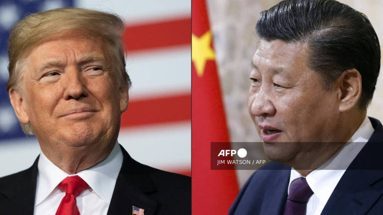 (COMBO) This combination of pictures created on May 14, 2020 shows recent portraits of China's President Xi Jinping (R) and US President Donald Trump. - AFP