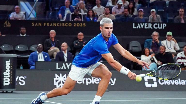 Sep 19, 2025; San Francisco, CA, USA; Team Europe player Carlos Alcaraz hits a volley during his doubles match against Team World in match four of the Laver Cup at Chase Center. - David Gonzales-Imagn Images via REUTERSPIX