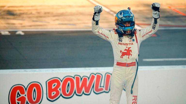 Connor Zilisch, driver of the #88 Registix Chevrolet, celebrates after winning the NASCAR Xfinity Series Mission 200. - Sean Gardner/Getty Images/AFP