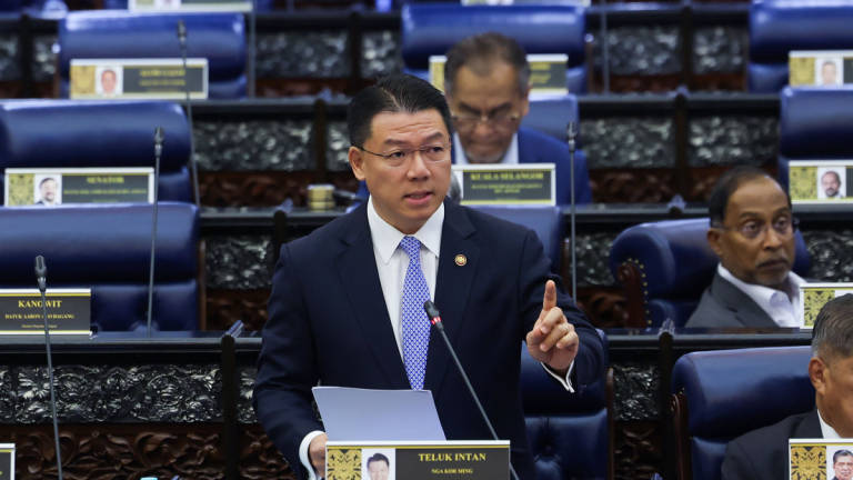 Housing and Local Government Minister Nga Kor Ming speaking at Parliament. - BERNAMA