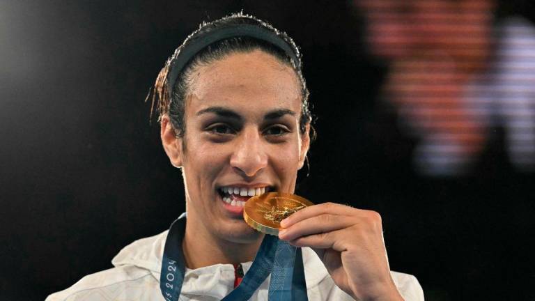 FILEpix: Gold medallist Algeria’s Imane Khelif poses on the podium during the medal ceremony for the women’s 66kg final boxing category during the Paris 2024 Olympic Games at the Roland-Garros Stadium. AFP