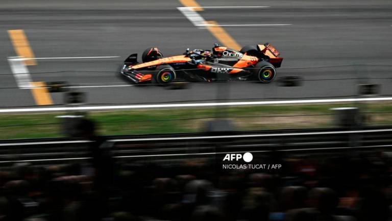 McLaren's Australian driver Oscar Piastri leads during the Formula One Dutch Grand Prix at The Circuit Zandvoort, western Netherlands, on August 31, 2025. - AFPPIX