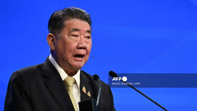 Thailand’s acting Prime Minister Phumtham Wechayachai delivers a speech during the fifth plenary session at the Shangri-La Dialogue Summit in Singapore on June 1, 2025. - AFP