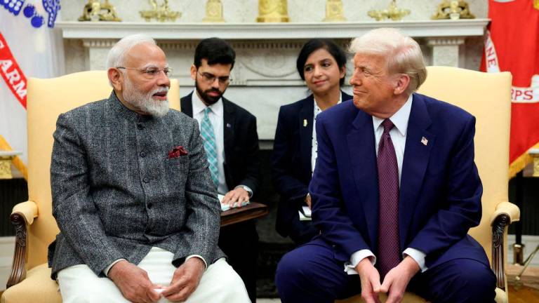 FILE PHOTO: U.S. President Donald Trump meets with Indian Prime Minister Narendra Modi at the White House in Washington, D.C., U.S., February 13, 2025. REUTERS/Kevin Lamarque/File Photo