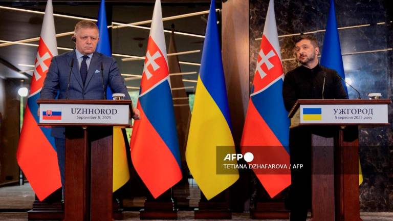 Ukraine's President Volodymyr Zelensky (R) and Prime Minister of Slovakia Robert Fico (L) give a press conference following their meeting in Uzhhorod on September 5, 2025. - AFP
