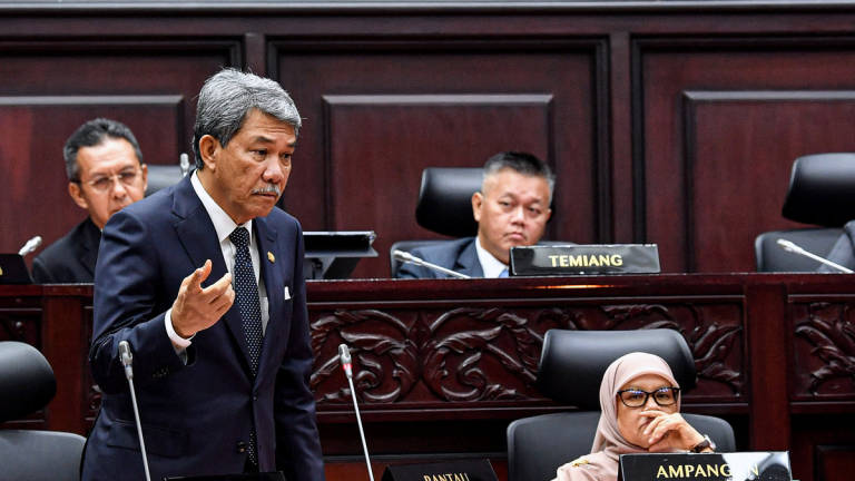 Foreign Minister Datuk Seri Mohamad Hasan (left), who is also the State Assemblyman for Rantau, raises a question during the Second Meeting of the Third Session of the 15th Negeri Sembilan State Legislative Assembly (DUN) today. – BERNAMA