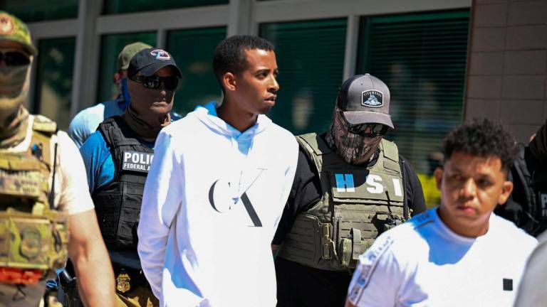 Law enforcement officers, including HSI and ICE agents, take people into custody at an immigration court in Phoenix, Arizona, U.S., May 21, 2025. REUTERSpix