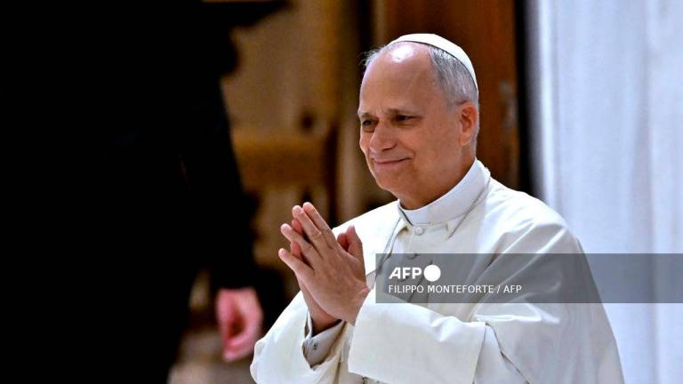 Pope Leo XIV acknowledges the pilgrims at the end of the audience of the Jubilee of the Roma, Sinti, and Travelling Peoples in Paul VI Hall at the Vatican on October 18, 2025. (Photo by Filippo MONTEFORTE / AFP)