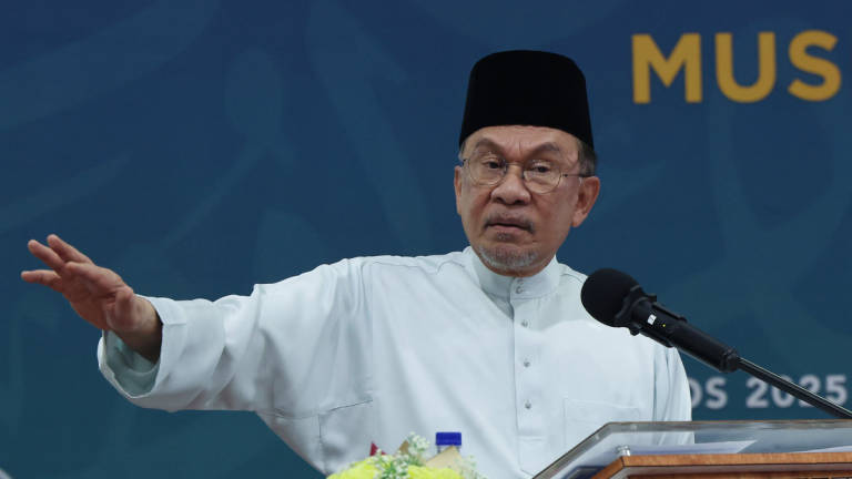 Prime Minister Datuk Seri Anwar Ibrahim delivers a speech at the Launch Ceremony of the 30th Language Translation of the Quran (Russian), the *Mushaf Al-Ummah*, and the Quran Shipment Container to France, held at the Quran Printing Complex, Nasyrul Quran Complex, Precinct 14, yesterday. – BERNAMA