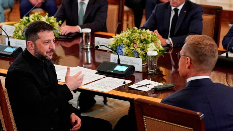 Ukrainian President Volodymyr Zelenskiy speaks with Finland's President Alexander Stubb during a meeting with U.S. President Donald Trump and European leaders amid negotiations to end the Russian war in Ukraine, at the White House in Washington, D.C., U.S., August 18, 2025. - REUTERSPIX