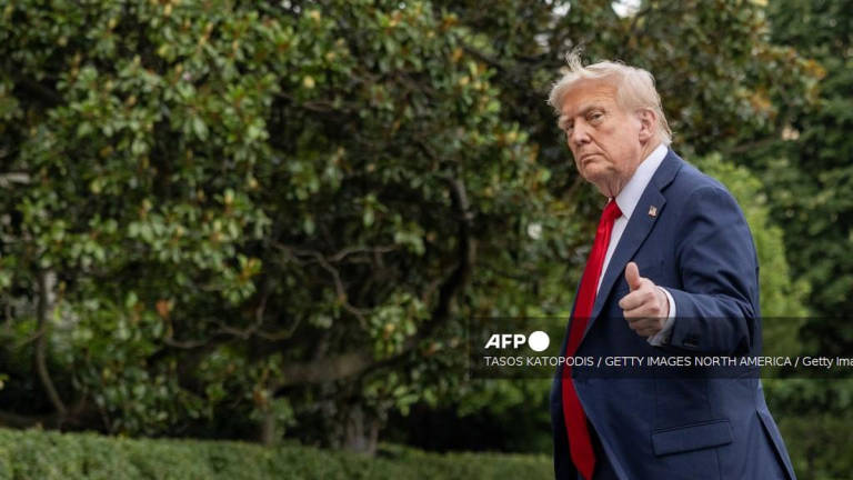 U.S. President Donald Trump walks into the White House on July 13, 2025 in Washington, DC. - Getty Images via AFP