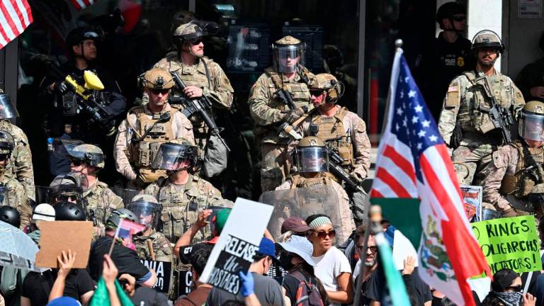 US Marines, California National Guard and Los Angeles Police stand guard on the steps of the Federal Building on June 14, 2025 in Los Angeles,AFPpix