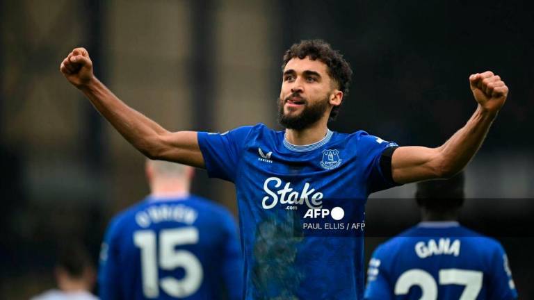 Everton's English striker #09 Dominic Calvert-Lewin celebrates creating their third goal, an own-goal from Tottenham Hotspur's English midfielder #14 Archie Gray during the English Premier League football match between Everton and Tottenham Hotspur at Goodison Park in Liverpool, north west England on January 19, 2025. - AFP