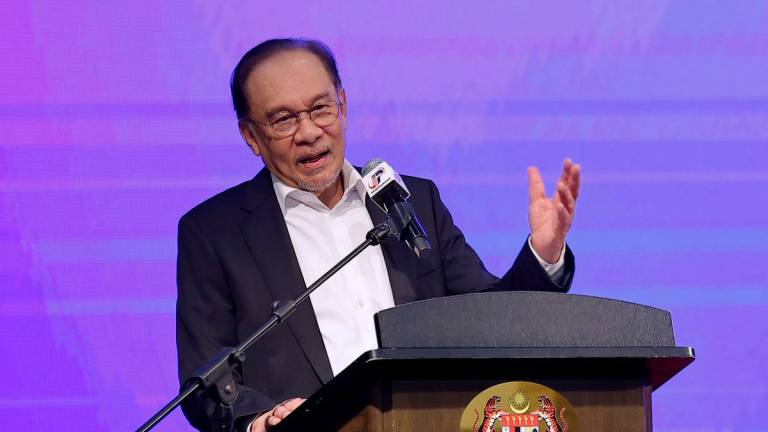 Anwar addressing civil servants at the monthly assembly of the Prime Minister’s Department. – Bernamapic
