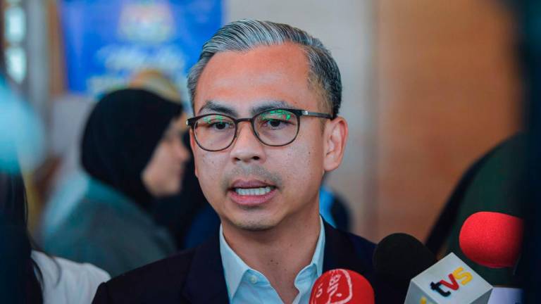 Minister of Communications, Datuk Fahmi Fadzil, speaking to members of the media after the 20th Public Service Premier Address (MAPPA) themed “MADANI Public Service” at the Putrajaya International Convention Centre (PICC) today. - BERNAMA