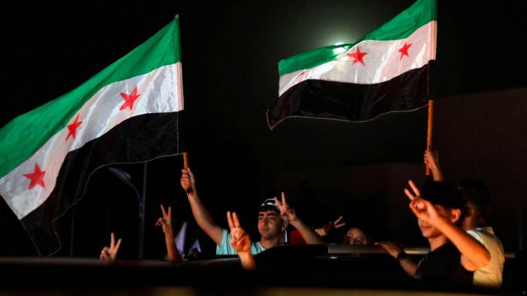 People celebrate in Damascus’ Omeyyad square after US President Donald Trump’s decision to lift sanctions in Syria, on May 13, 2025. AFPpix