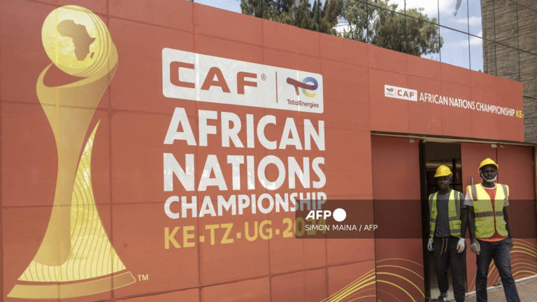 Construction workers exit the main gate at the Nyayo national stadium VIP entrance, in Nairobi on July 28, 2025, ahead of the CAF African Nations Championship (CHAN) 2024. - AFP