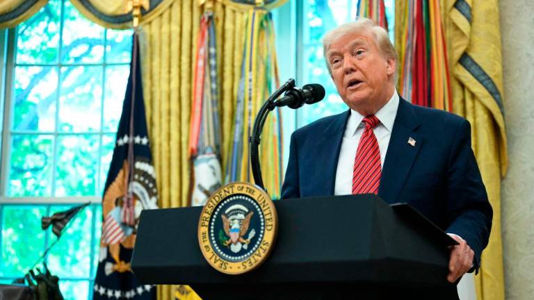 US President Donald Trump speaks during a swearing-in ceremony for the Ambassador to China, former Republican Senator of Georgia, David Perdue, in the Oval Office of the White House in Washington, DC, May 7, 2025. AFPpix