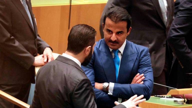 Syrian President Ahmed al-Sharaa (L) chats with Qatar's Emir Sheikh Tamim bin Hamad Al Thani (R) as they attend a United Nations Summit on Palestinians at UN headquarters during the United Nations General Assembly (UNGA) in New York on September 22, 2025. - AFPPIX