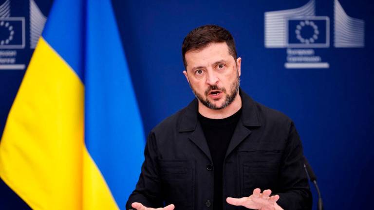 Ukraine’s President Volodymyr Zelensky speaks during a joint press conference with European Commission President in Brussels, on August 17, 2025. (Photo by Simon Wohlfahrt / AFP)