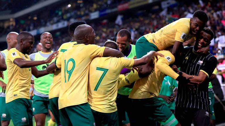 Football - FIFA World Cup - CAF Qualifiers - Group C - South Africa v Rwanda - Mbombela Stadium, Mbombela, South Africa - October 14, 2025South Africa's Evidence Makgopa celebrates scoring their third goal with teammates - REUTERSPIX