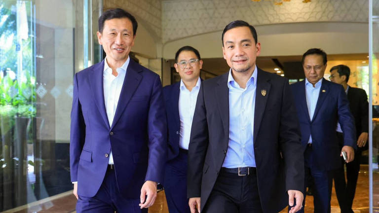 Johor Menteri Besar Datuk Onn Hafiz Ghazi pictured with Singapore’s Health Minister Ong Ye Kung during a high-level discussion in Singapore. (Credit: Onn Hafiz Ghazi / Facebook)